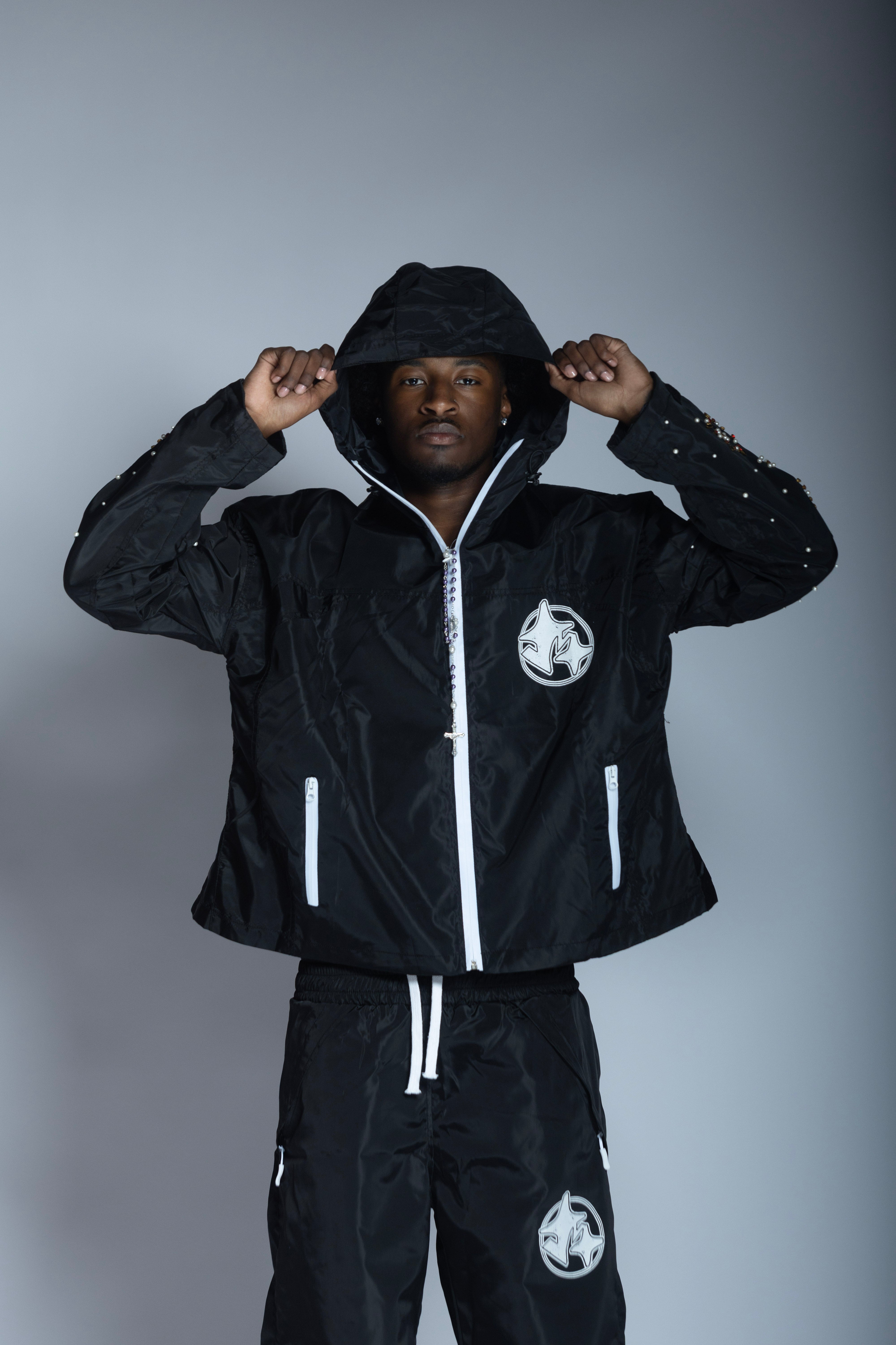 ‘triumph’ black rain jacket